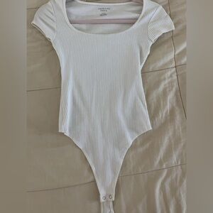 White Ribbed woman’s One Piece bodysuit